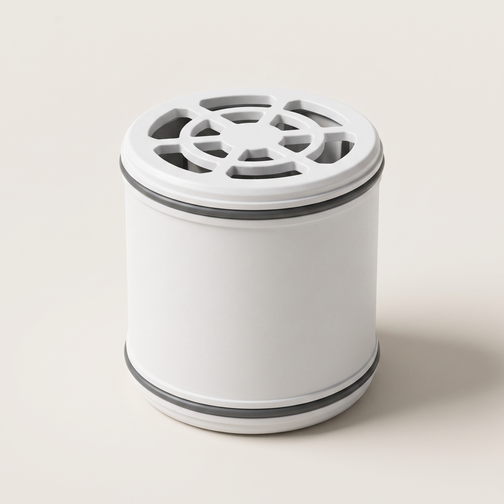The replacement filter cartridge: a white cylinder with a slotted vent cap.